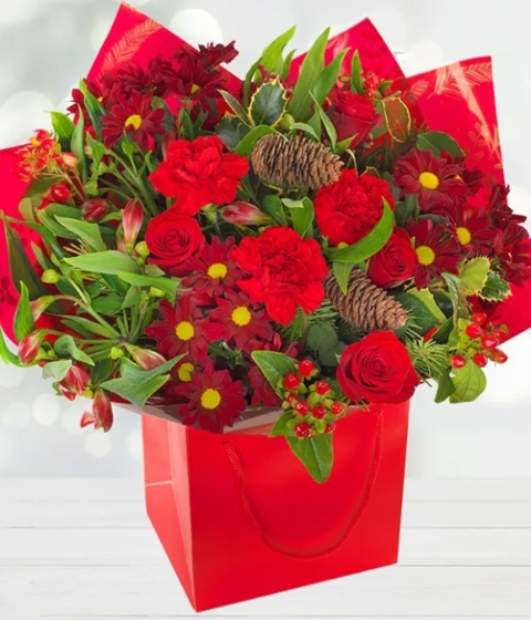 christmas delight ( florist choice in red, greens,whites)